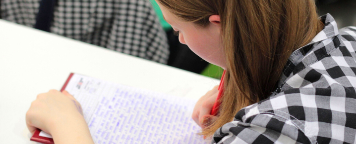 Female student writing Female student writing