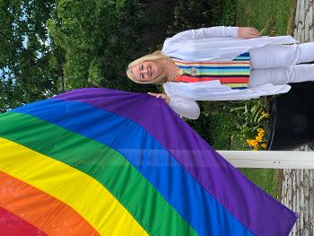 Provost Cameron with rainbow flag