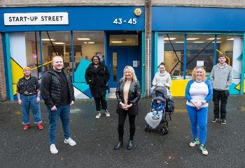Group photo of business owners outside Start-Up Street Paisley