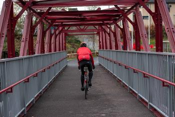 Local Renfrewshire cyclist on White Cart Footbridge