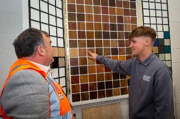 Councillor Nicolson speaking to City Gate Construction apprentice Danny Dempsey