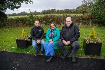 Austin Reid from Finco contracts who carried out the work and donated the planters; Councillor Michelle Campbell, Convener of Renfrewshire Council's Infrastructure, Land and Environment Policy Board; Bishopton resident Derek Prentice.