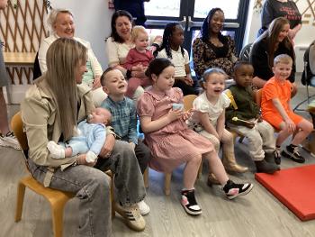Children sit in seats.