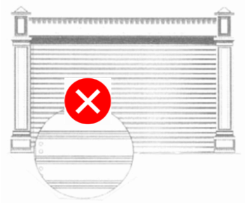 Closed metal roller shutter with horizontal slats and a magnified detail inset; a red circle with a white “X” overlays the inset, indicating the shutter type is not allowed.