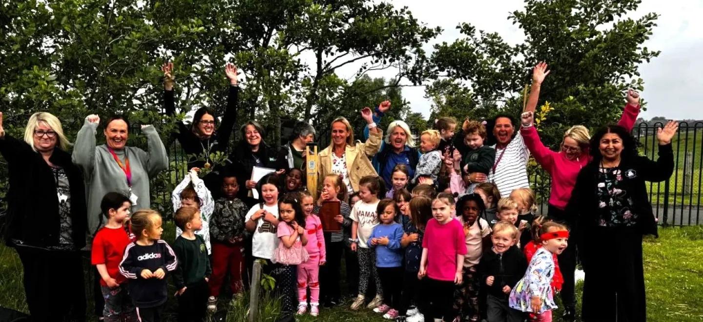 Group photo of pupils and teachers at West Johnstone ELCC celebrating