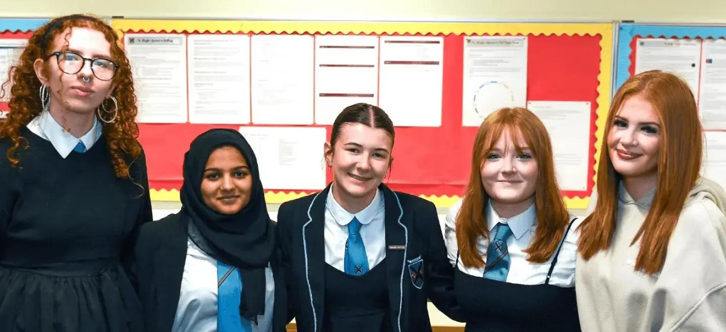 5 pupils smiling