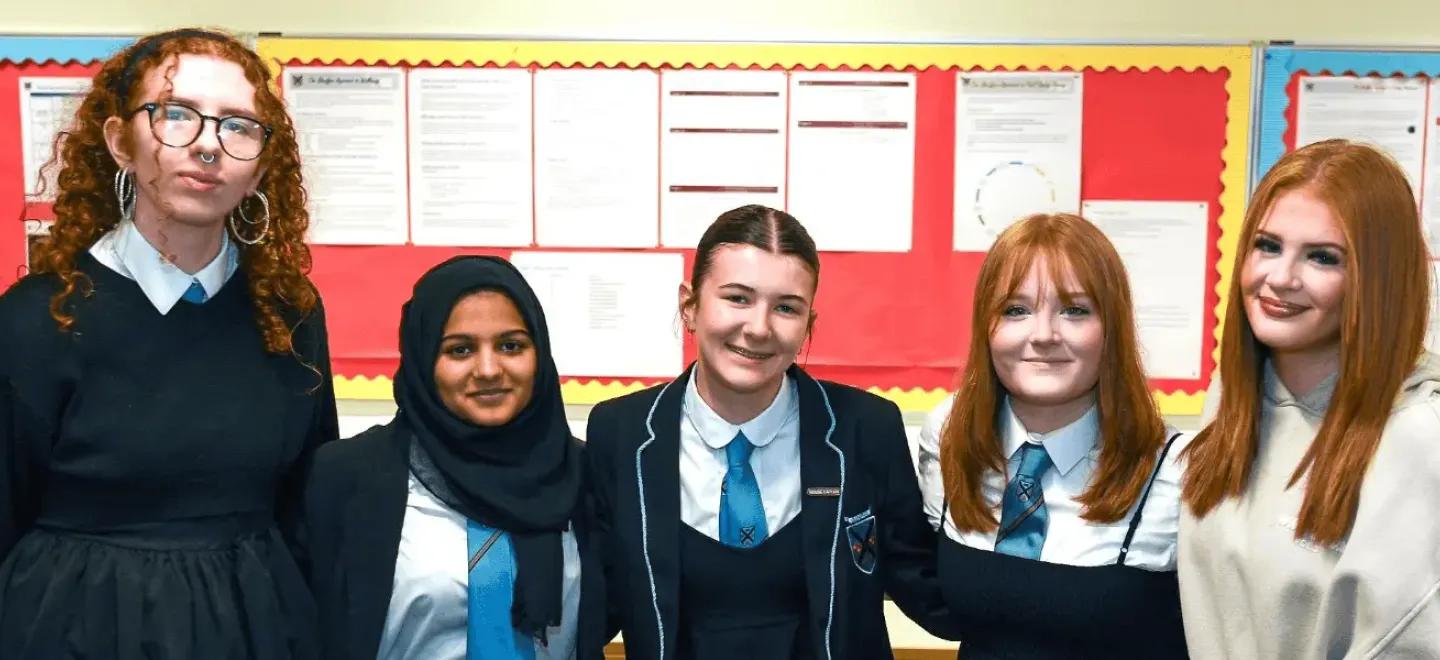 5 pupils smiling