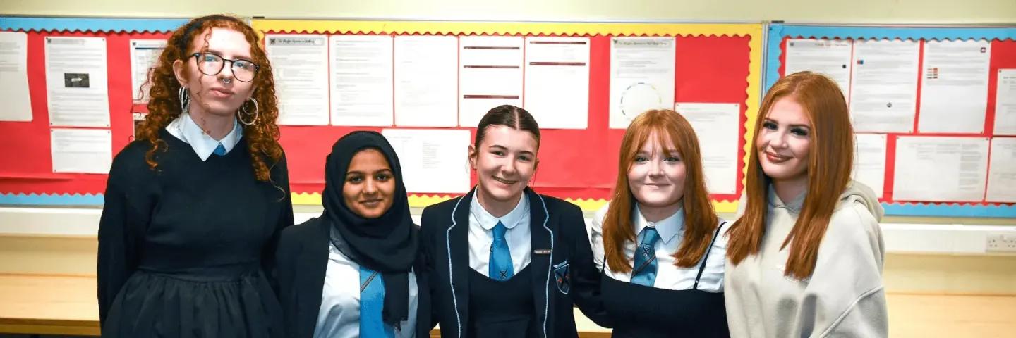5 pupils smiling