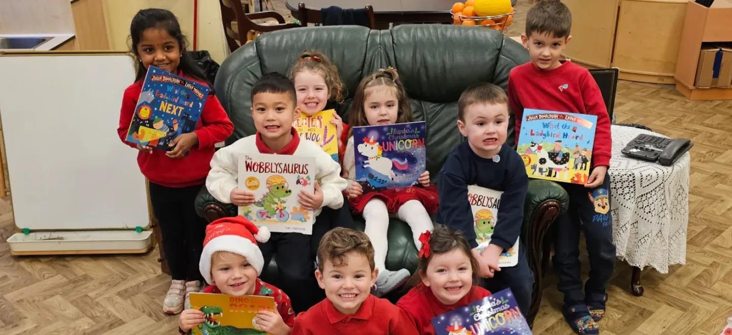 A group of children holding books.