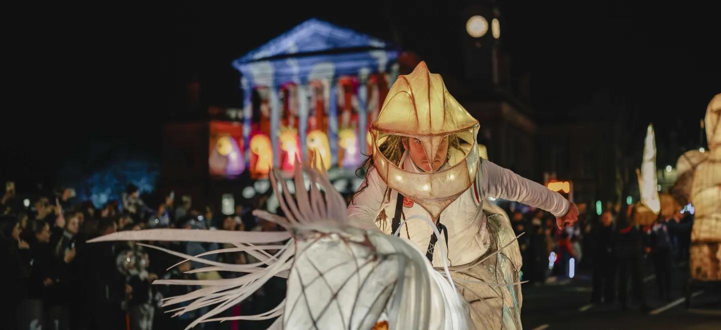 A man wearing an illuminated knight costume taking part in the Paisley Halloween Festival parade
